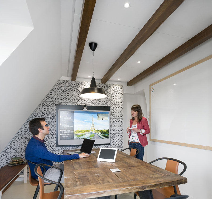 The mansard roof form is expressed in the space.